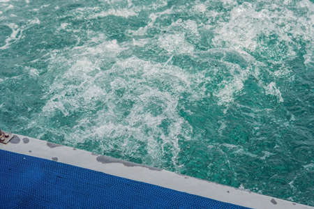 Spray into the sea after a man dived.の写真素材