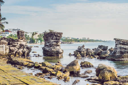 Rocks in the sea and view of the island of Phu Quoc, Vietnam.の写真素材