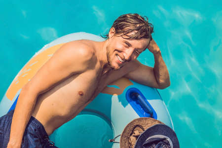 Young man having fun at water parkの写真素材