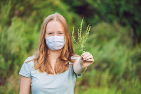 Young woman in a medical mask because of an allergy to ragweed.の写真素材