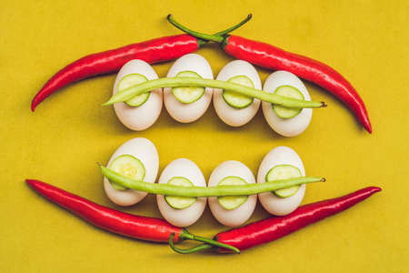 Eggs, peppers, beans and cucumbers in the form of teeth and breakets. varities of orthodontic bracket or brace.の写真素材