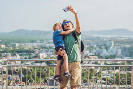Father and son on High view from Phuket View Point Rang Hill in Phuket Thailand.の写真素材