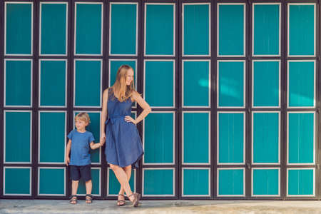 Mom and son are tourists on the Street in the Portugese style Romani in Phuket Town. Also called Chinatown or the old town. Traveling with children conceptの写真素材