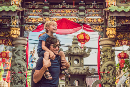 Dad and son are tourists on the Street in the Portugese style Romani in Phuket Town. Also called Chinatown or the old town. Traveling with children conceptの写真素材