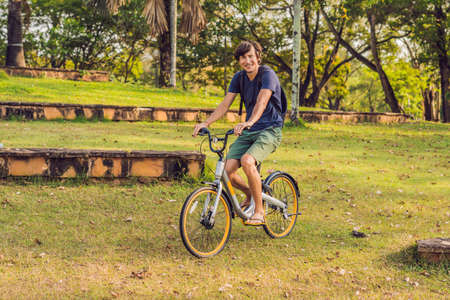 Young fit man during a bike ride on a sunny day.