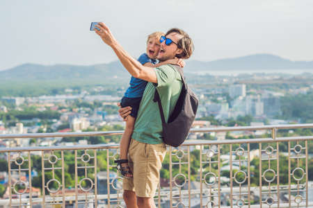 Father and son on High view from Phuket View Point Rang Hill in Phuket Thailand.の写真素材