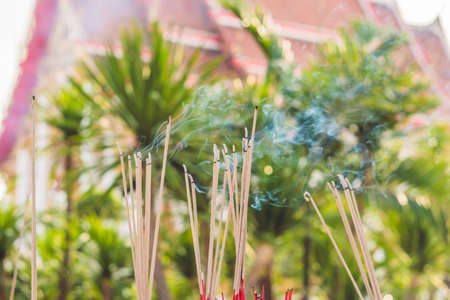 Smell the smoke of Incense, The smoke of joss stick in temple, smoke of incense in the spirit shrine.の写真素材