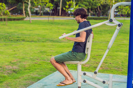 Man in the street gym in the park.