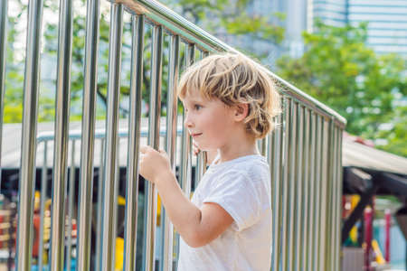 Funny cute happy baby playing on the playground. The emotion of happiness, fun, joyの写真素材