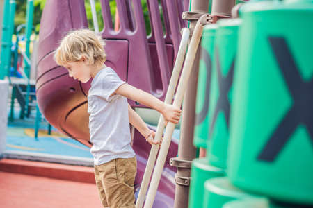 Funny cute happy baby playing on the playground. The emotion of happiness, fun, joyの写真素材