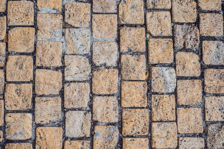 Background of old vintage square bricks, texture.の写真素材