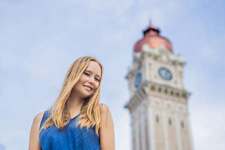 Young woman on background of Sultan Abdul Samad Building in Kuala Lumpur, Malaysia.の写真素材