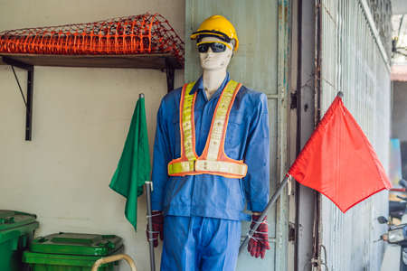 Fake traffic mannequin in the clothes of a road worker.の写真素材