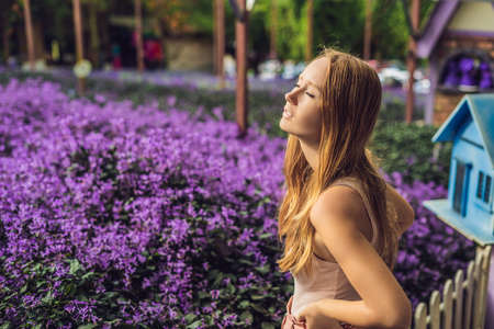 Young woman on lavender field. Lavender farm concept.の写真素材