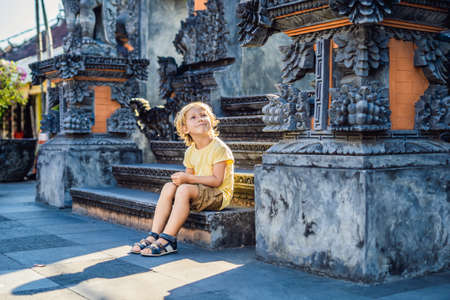 Boy tourist on the background of Tanah Lot - Temple in the Ocean. Bali, Indonesia. Traveling with children concept.の写真素材