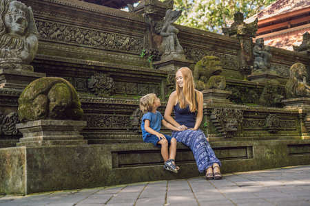 Mom and son travelers discovering Ubud forest in Monkey forest, Bali Indonesia. Traveling with children concept.の写真素材