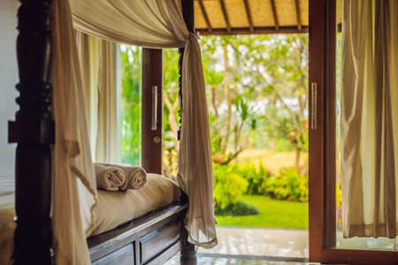 Beautiful room in villa, towel on the bed.の写真素材