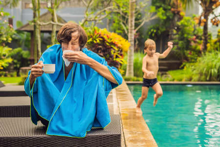 The man caught a cold on vacationの写真素材