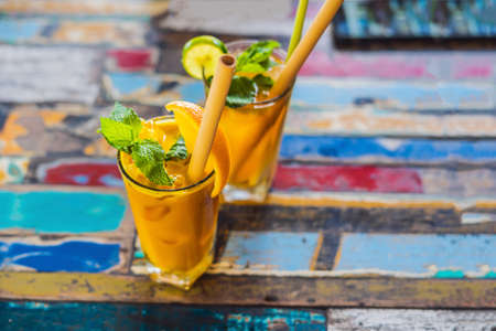 Immune boosting, anti inflammatory smoothie with orange and turmeric. Detox morning juice drink,...