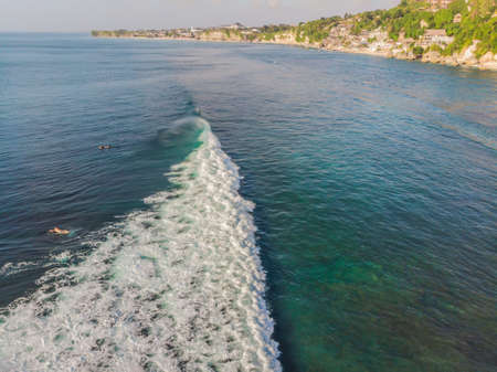 Surfers on the waves in the ocean, top view.の写真素材