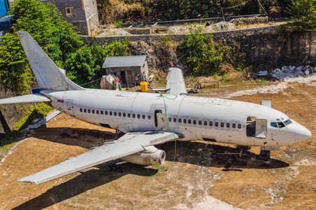 An old passenger aircraft on aviation waste.の写真素材
