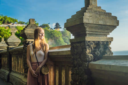 Young woman traveler in Pura Luhur Uluwatu temple, Bali, Indonesia.の写真素材