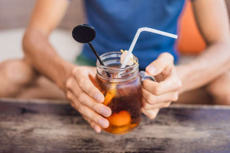Ice lychee tea in mason jar in the cafe.の写真素材