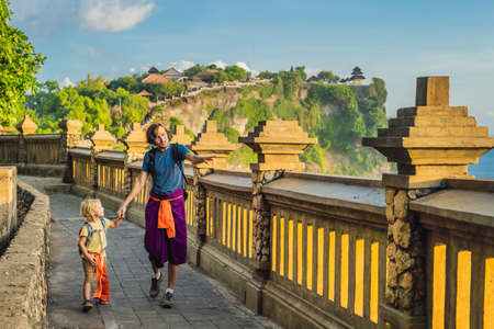 Dad and son travelers in Pura Luhur Uluwatu temple, Bali, Indonesia.の写真素材