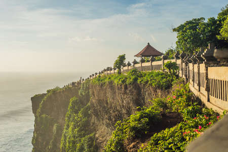 Pura Luhur Uluwatu temple, Bali, Indonesia. Amazing landscape - cliff with blue sky and sea.の写真素材