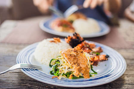 Squid grill with rice. Balinese cuisine Indonesia.の写真素材