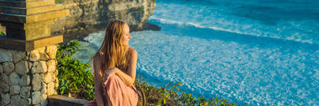 Young woman traveler in Pura Luhur Uluwatu temple, Bali, Indonesia.の写真素材