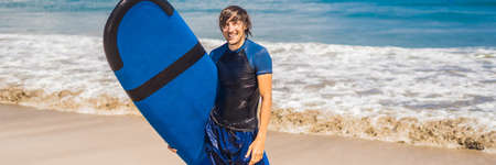 Man carrying surfboard over his head.