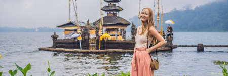 Young woman traveler in  Pura Ulun Danu Bratan, Bali.の写真素材