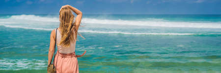 Young woman traveler on amazing Melasti Beach with turquoise water, Bali Island Indonesia.の写真素材