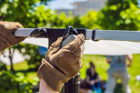 Grip team, light depurtment members prepare the lighting equipment before shooting.の写真素材