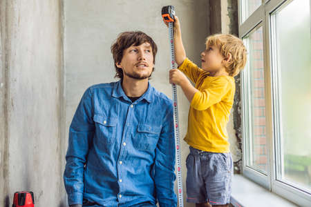 Father and son repair windows together. Repair the house yourself.の写真素材
