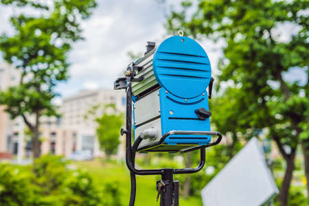Grip team, light depurtment members prepare the lighting equipment before shooting.の写真素材
