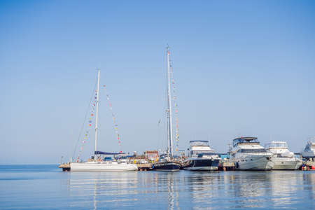 Yachts parking in harbor at sunset, Harbor yacht club.