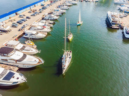 Yachts parking in harbor at sunset, Harbor yacht club.の写真素材