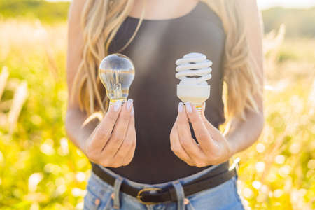 Zero waste concept. Use an incandescent lamp or an energy-saving lamp. Zero waste, green and conscious lifestyle concept.の写真素材