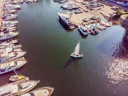 Yachts parking in harbor at sunset, Harbor yacht clubの写真素材