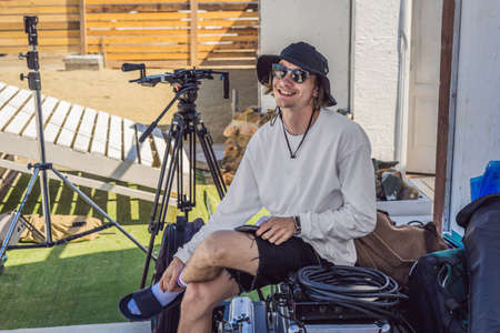 Gaffer or the chief electrician in a motion-picture or television production unit set up the lights...