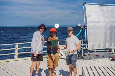 Camera operator, director and dp discuss the process of a commercial video shoot
