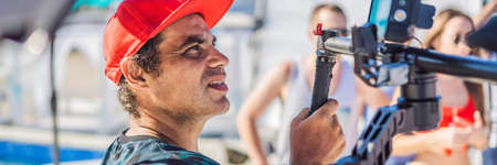 Professional Steadicam operator uses a 3-axis camera stabilizer system on a commercial production setの写真素材