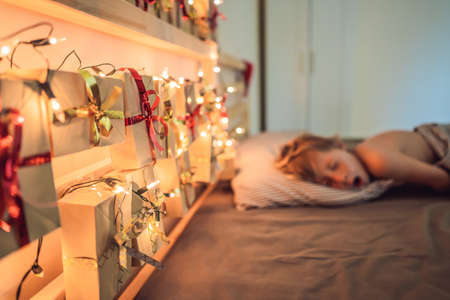 The boy is sleeping on the bed.の写真素材