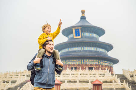 Dad and son travelers in the Temple of Heaven in Beijing. One of the main attractions of Beijing.の写真素材