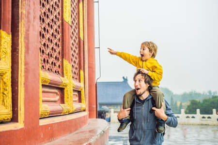 Dad and son travelers in the Temple of Heaven in Beijing. One of the main attractions of Beijing.の写真素材