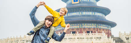 Dad and son travelers in the Temple of Heaven in Beijing. One of the main attractions of Beijing.の写真素材