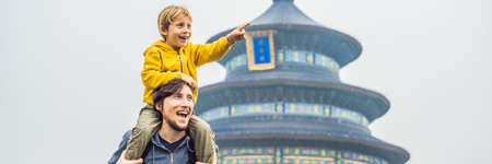 Dad and son travelers in the Temple of Heaven in Beijing.の写真素材