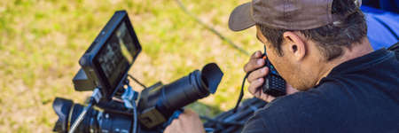 Shooting process on cinema stage - commercial production set, exterior location.
